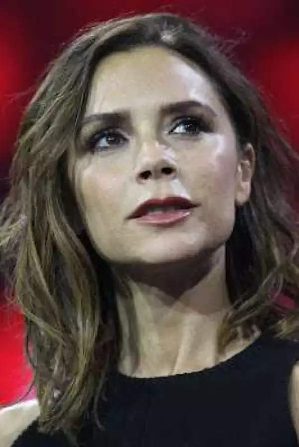 Victoria Beckham shows off super slim frame for a rare stage appearance with husband David